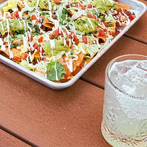 plate of nachos and a margarita